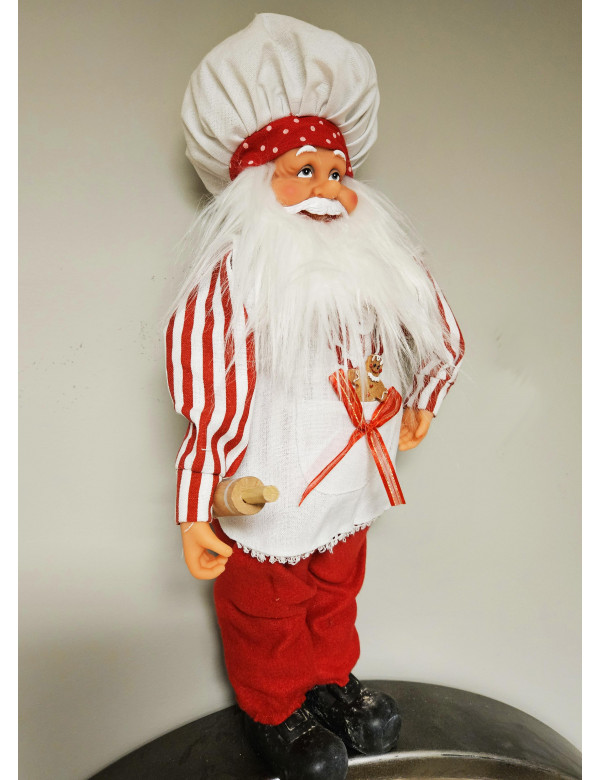 Père Noël cuisinier debout