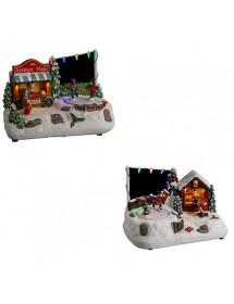 Village de Noël lumineux avec stand de chocolat et patinoire